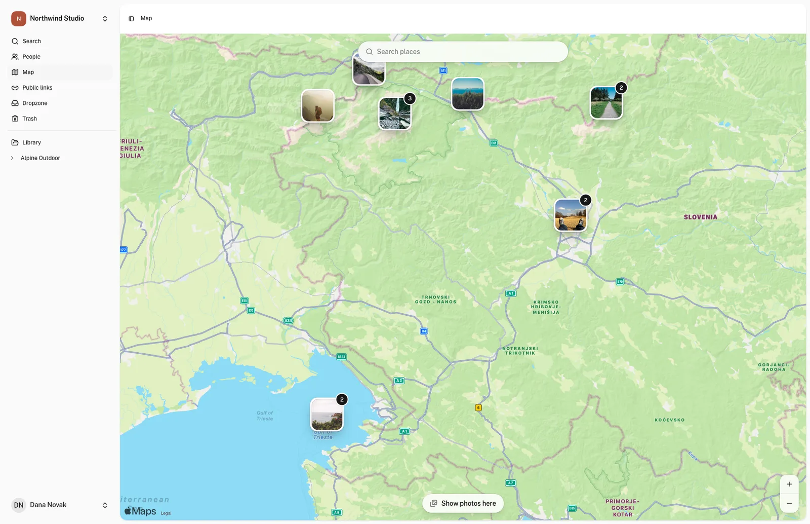 The OLO map zoomed in on Slovenia, with photo thumbnails pinned at the Julian Alps, Ljubljana and the coast. Some pins carry a count of the photos taken there.